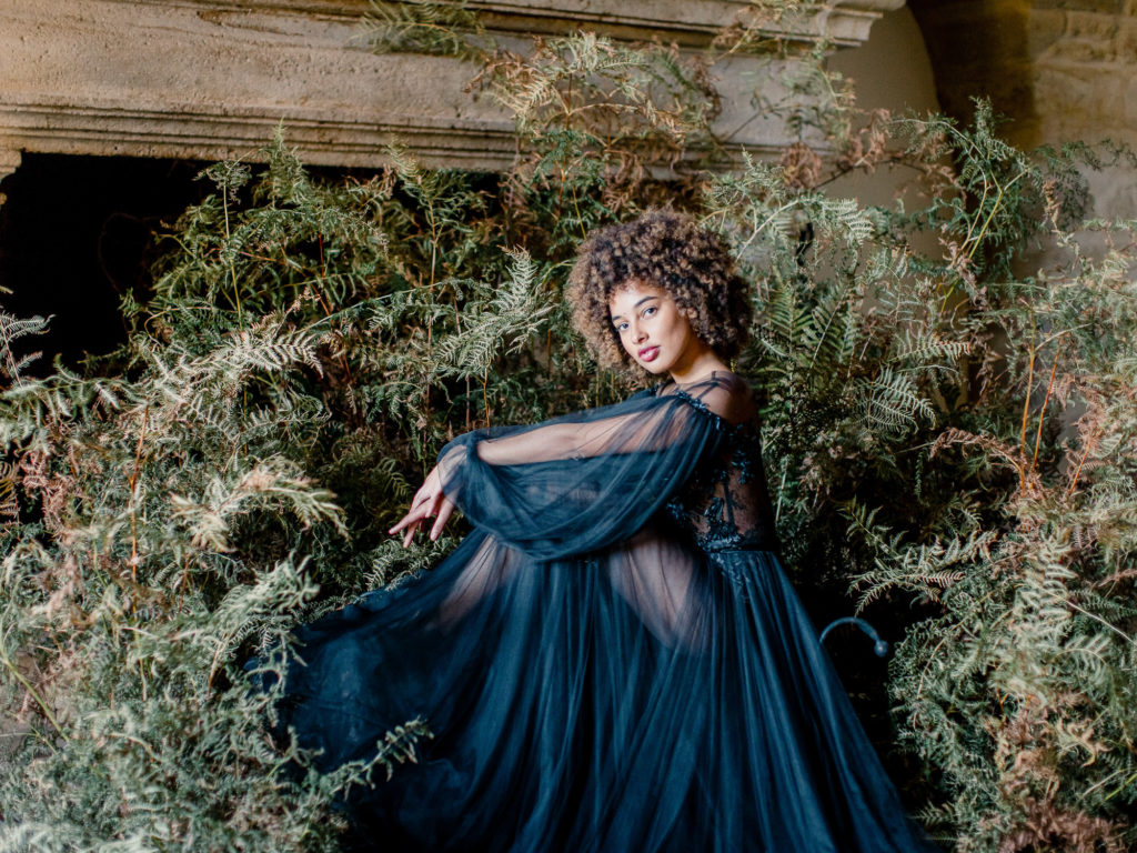 An ethereal french bridal boudoir with a gauzy black Daalarna dress