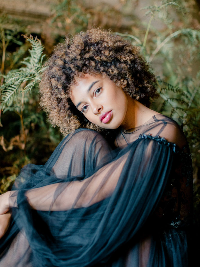 An ethereal french bridal boudoir with a gauzy black Daalarna dress