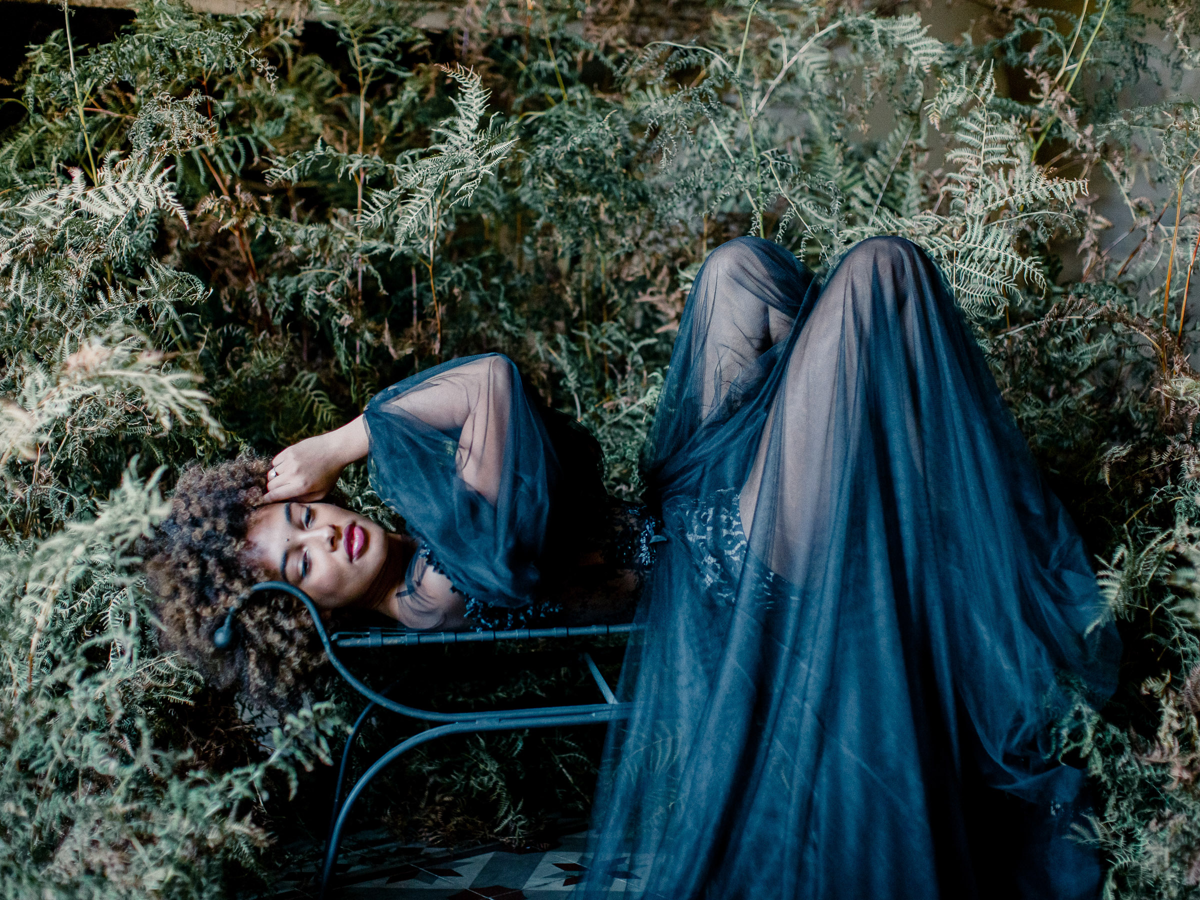 An ethereal french bridal boudoir with a gauzy black Daalarna dress